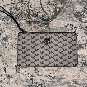 Michael Kors monogram clutch bag.